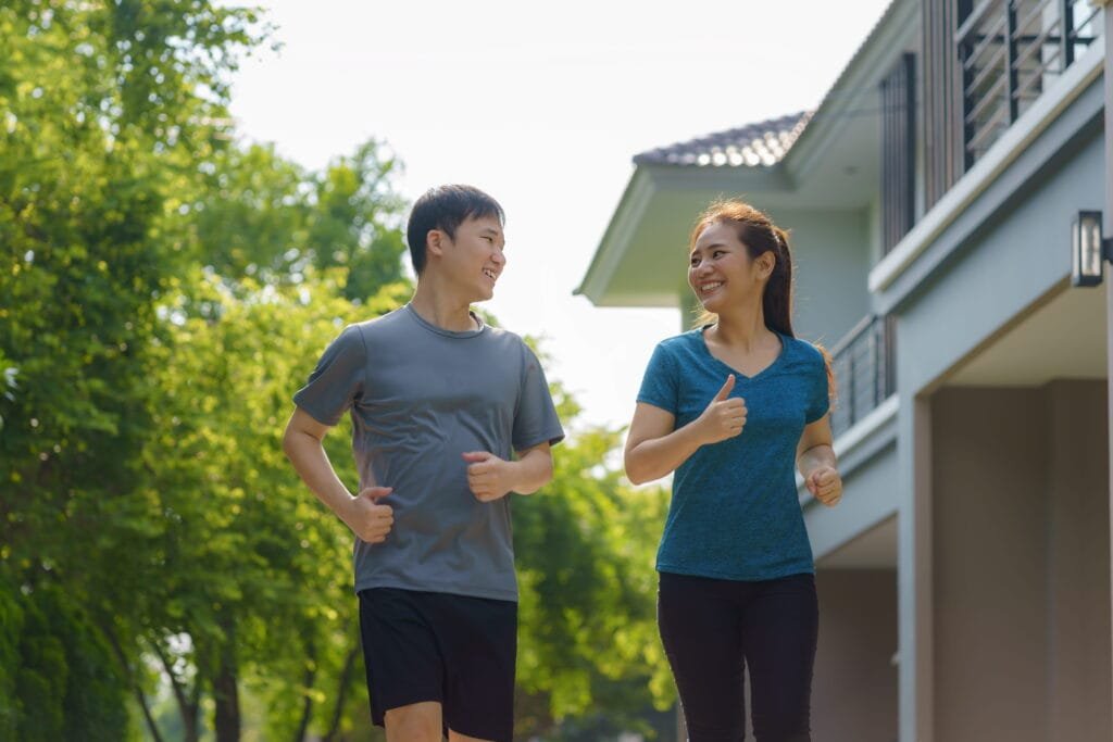 a couple doing their daily run on their village