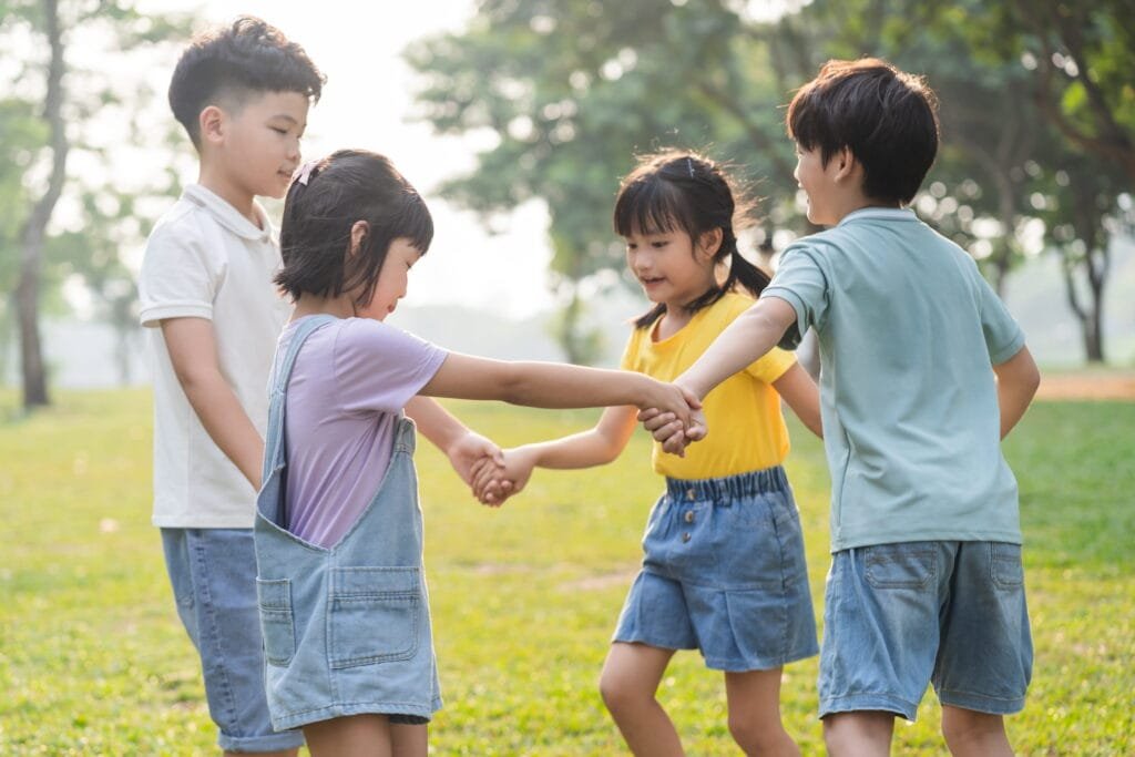 children playing in a green field